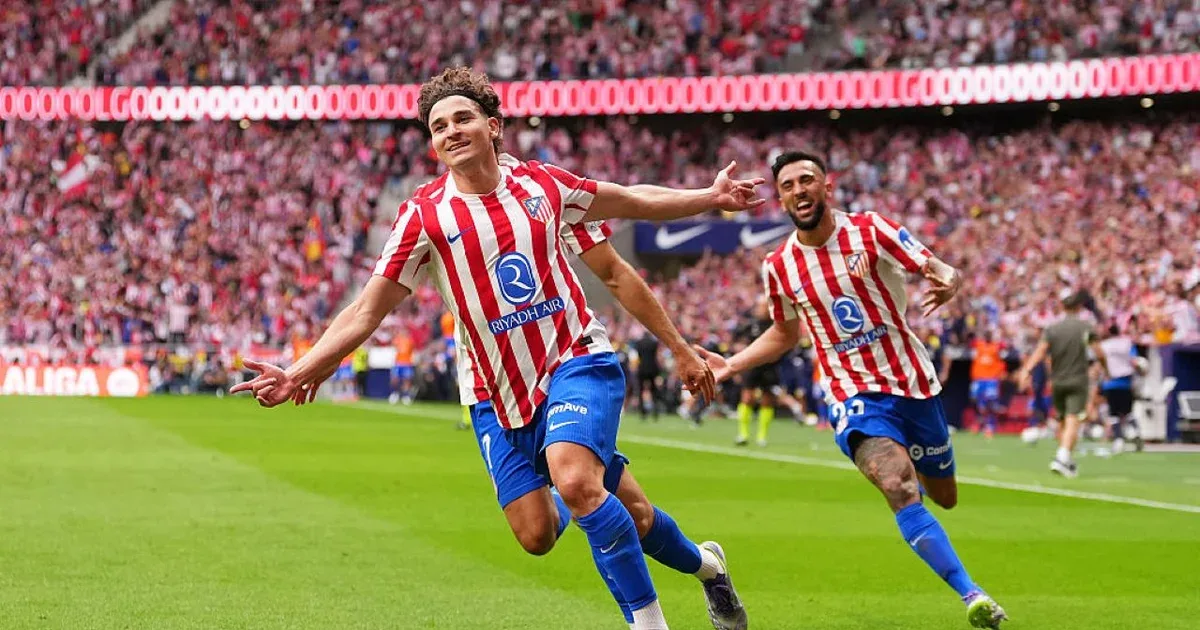 Jogadores do Atlético de Madrid em ação no relvado